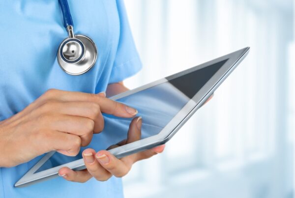 Healthcare worker with ipad