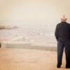 Older man looking over the sea