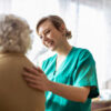 Aged care worker looking after elderly lady